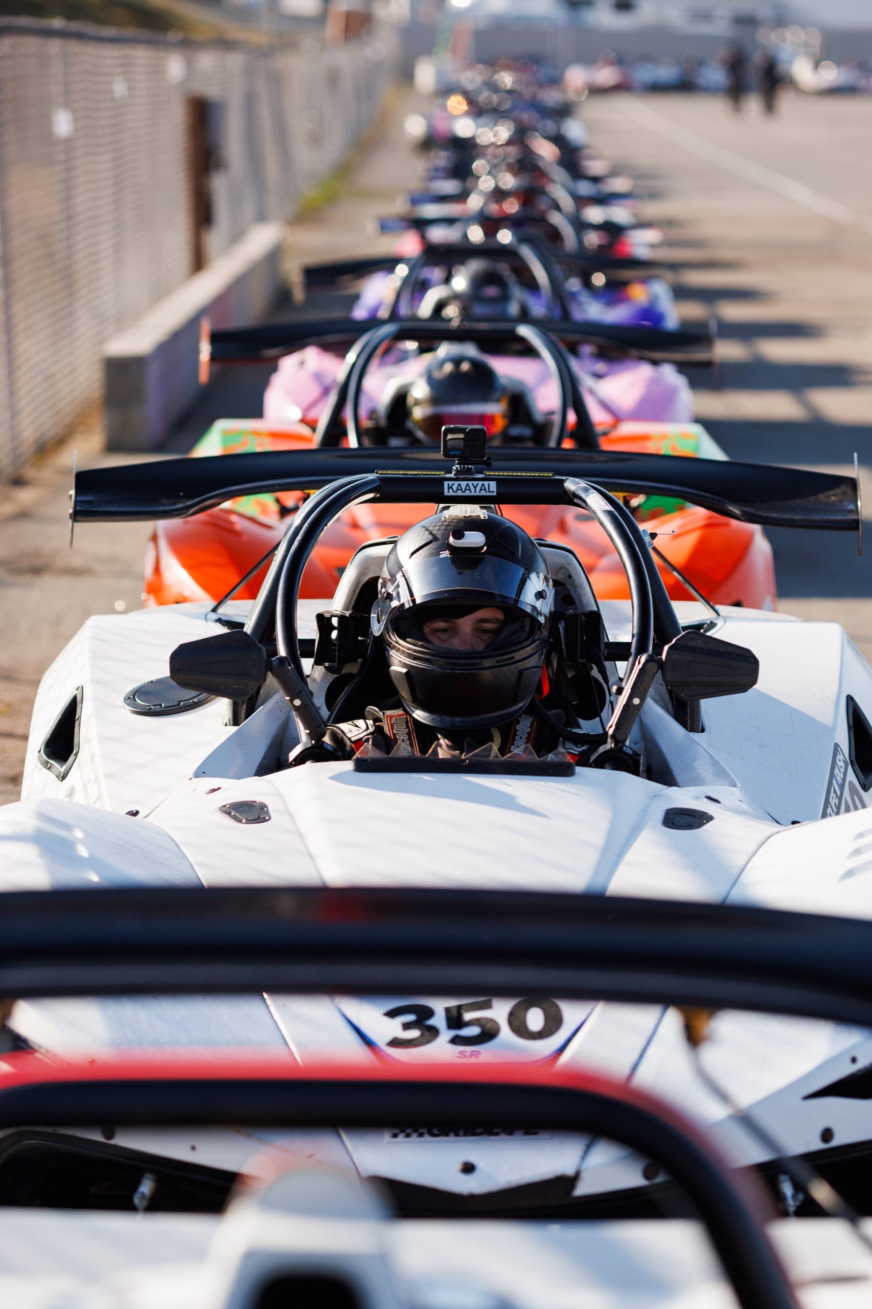 Driver waiting in a GRIDLIFE spec race car as the field lines up on the grid