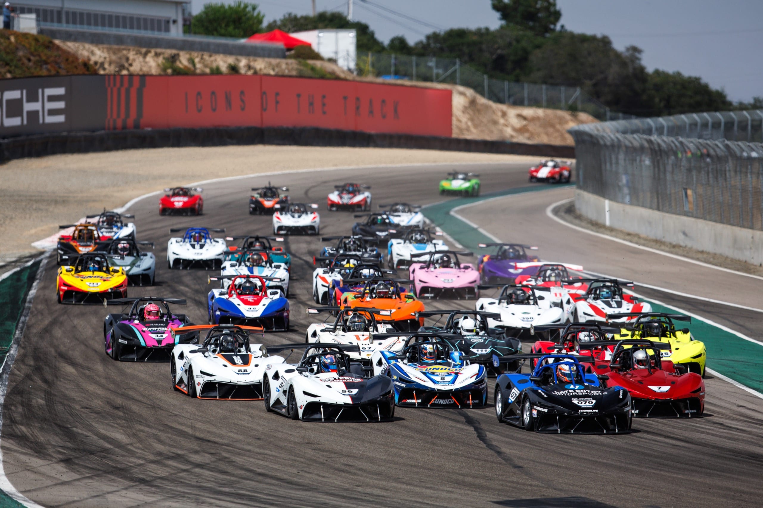 GRIDLIFE grid packed with spec race cars launching from the start at Laguna Seca
