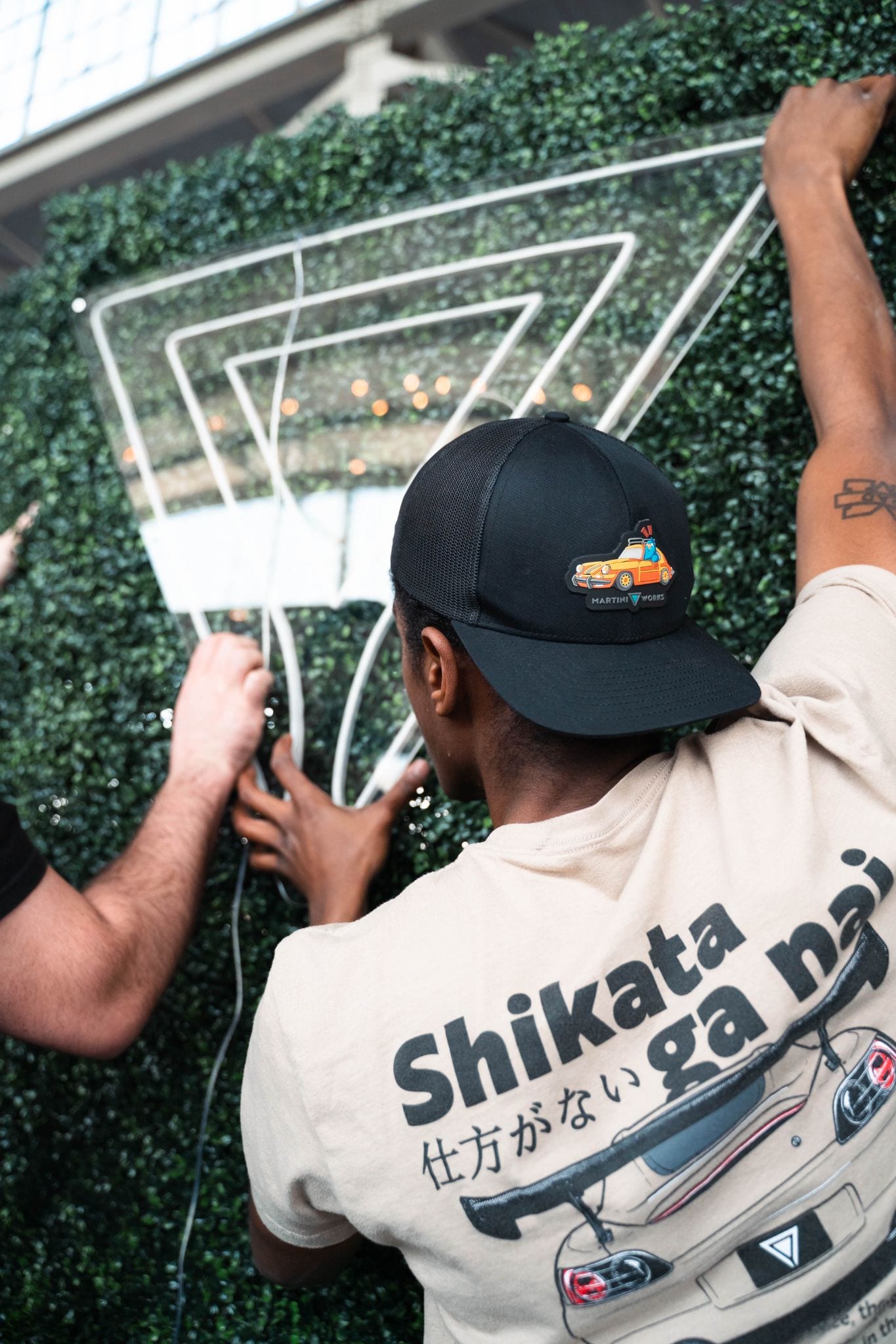 MetaMartini team installing signage and brand activation elements at an event build-out